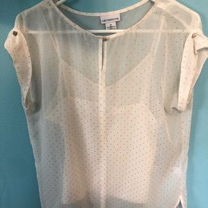 Off white with gold polka dots. Like new.